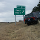 The Jeep poses in front of a Jeep Road sign somewhere in the middle of nowhere, Kansas.